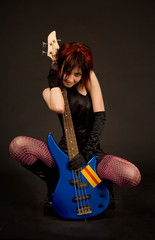 Sensual girl with electric guitar