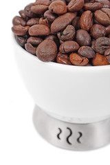 Cup of coffee beans isolated on white background