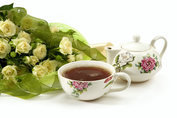 White roses bouquet and tea