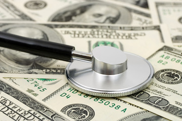 Stethoscope on money background