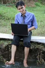 man with laptop in nature