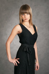 Fototapeta premium girl in a dress on a grey background