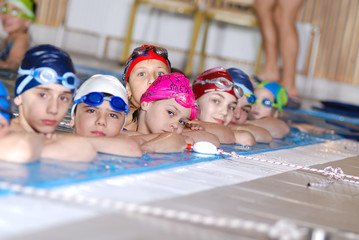 .childrens in serie at swimming pool