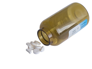 Tablets with glass bottle isolated on white background