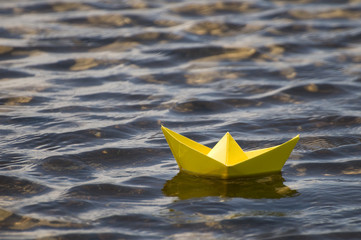 Paper ship in water