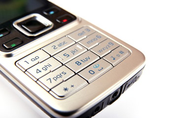 Modern silver mobile phone close-up isolated