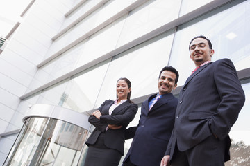 Group of business people outside office building