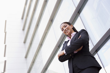 Businesswoman standing outside office building