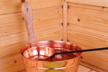Bucket with water in sauna