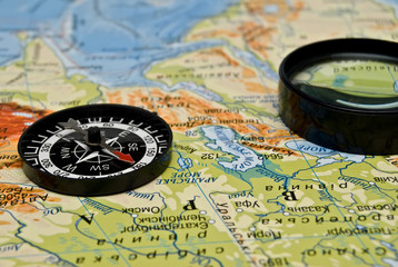 compass on a background a map