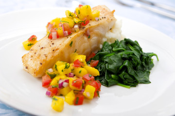 Sea bass with mango salsa,  mashed potato and spinach