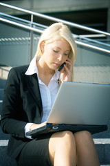 Young businesswoman with laptop