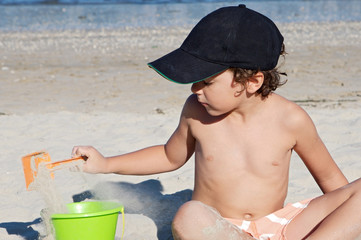 boy playing in the beach