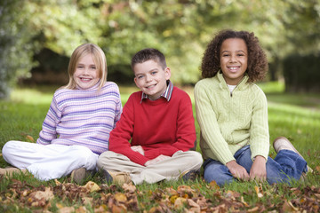 Group of children sitting in garden