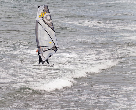 Windsurfer sufing on the sea of beach Pozo Izquierdo. Gran Canar