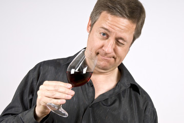 Man Holding a Glass of Red Wine