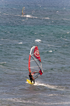 Windsurfer sufing on the sea of beach Pozo Izquierdo. Gran Canar