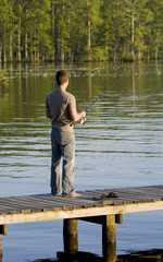 Man fishing off a dock