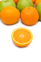 Oranges and apples isolated on the white