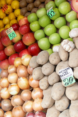 Fruit laid out on sale with price lists