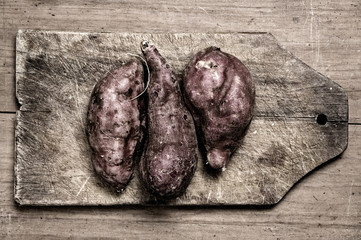 Sweet potatoes on table.