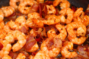Chili shrimps with bacon, garlic, spices and lemon grass