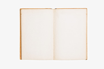 Open vintage book on white background.