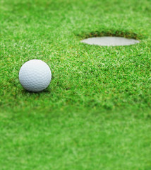 Golf - detail ball with hole on green