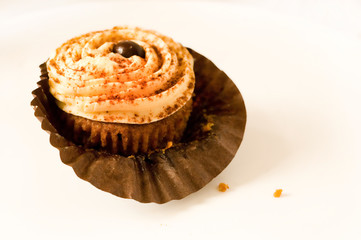 Toffee filled chocolate cupcake with buttery icing.