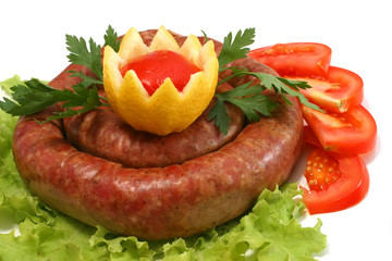 home made sausage on lettuce with lemon