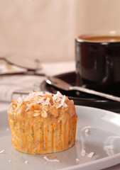 Tropical pineapple and nut muffin with coffee