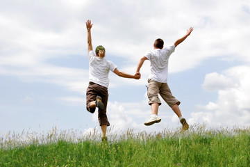 Happy young couple jumping