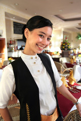 beautiful restaurant staff pose at work