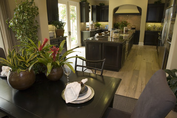 Kitchen and breakfast table with modern tableware.