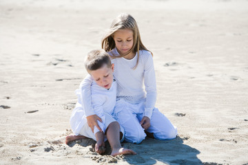 Protective girl with her younger brother