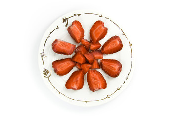 Sliced strawberries on plate