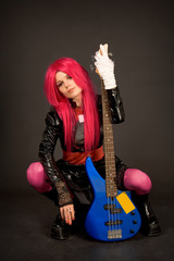 Fototapeta premium Romantic girl with guitar holding cigarette