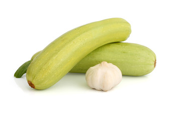 Vegetable marrow and bulb of garlic on white background