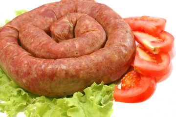 domestic made sausage on lettuce