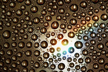 Water droplets on colored background