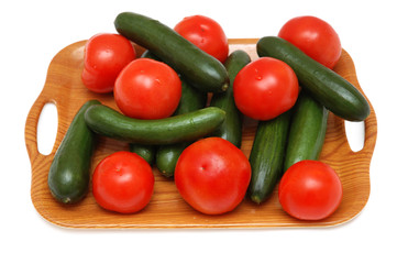 Fototapeta na wymiar Cucumbers and tomatoes isolated on the white