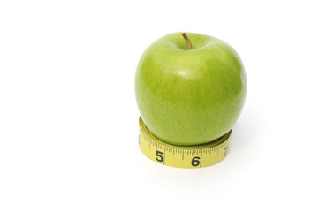 Green apple and yellow ruler