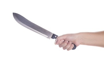 Big kitchen knife in female hand. Isolated on white.