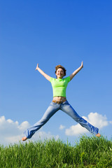 Fototapeta na wymiar happy young woman is jumping