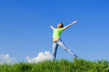happy young woman is jumping