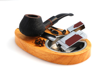 Tobacco-pipes and ashtray isolated in white