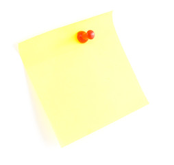 Yellow sticky note and push pin on white