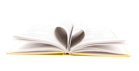 pages of a book curved into a heart shape