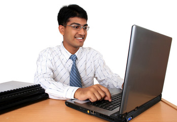 Young Indian business man working at his desk (Series)