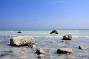 chalk-rocks in the blue sea - 7992328